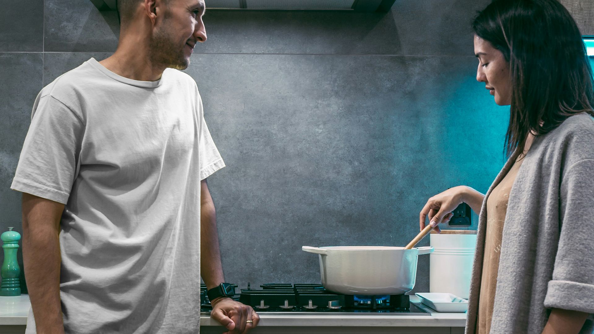 woman and man standing inside kitchen room