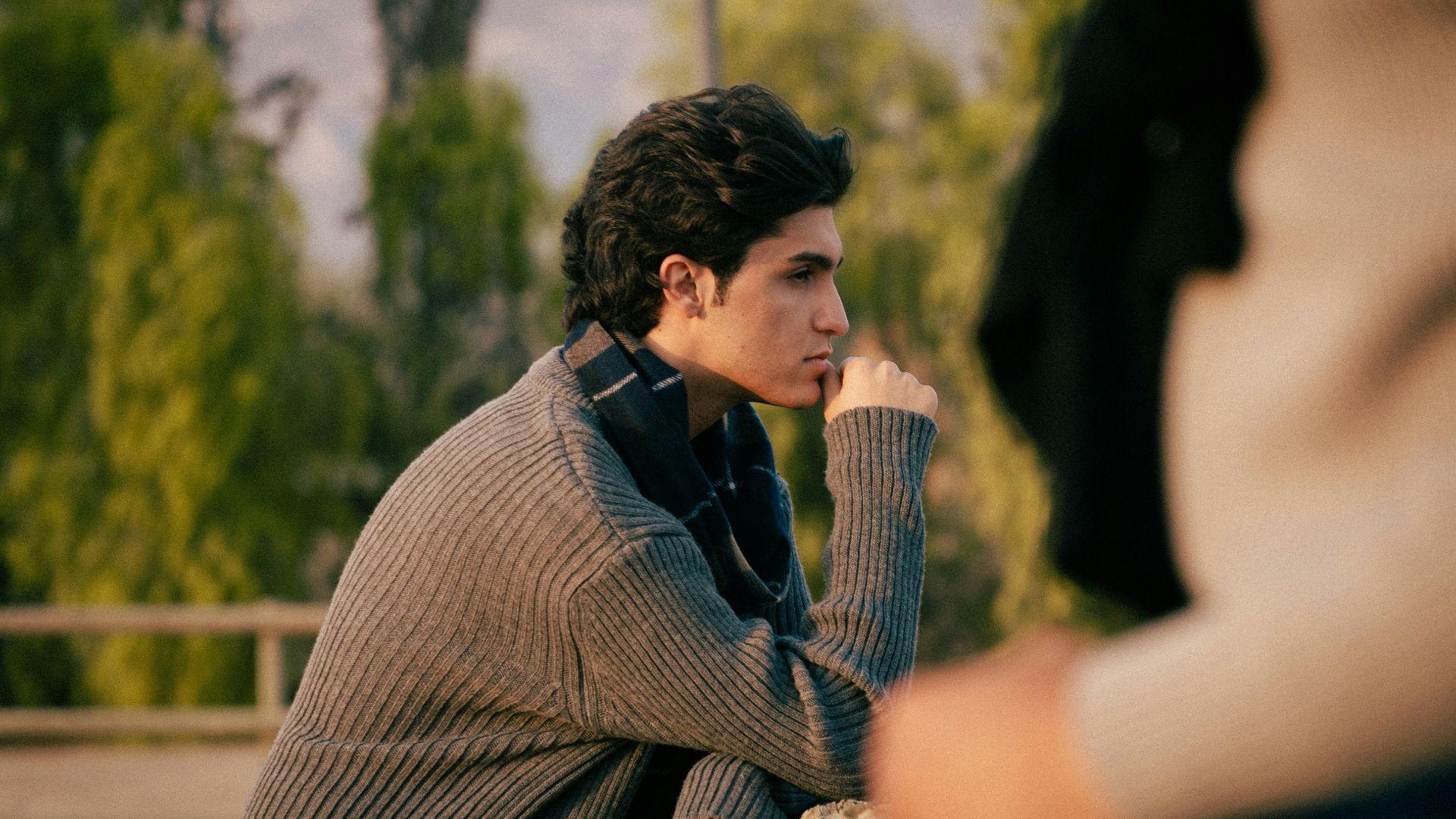 Young man looking thoughtfully into the distance