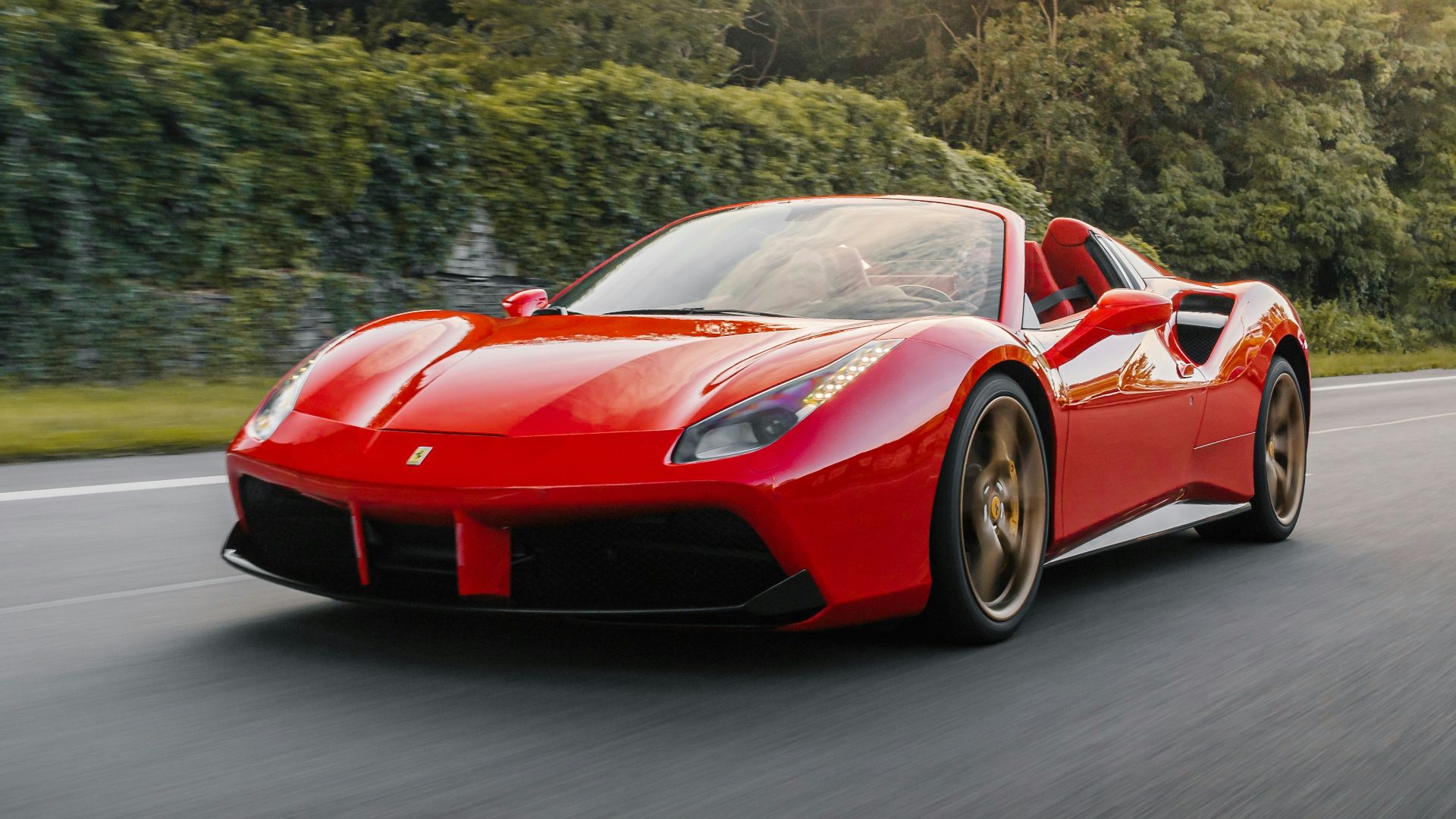 red ferrari 458 italia on road during daytime