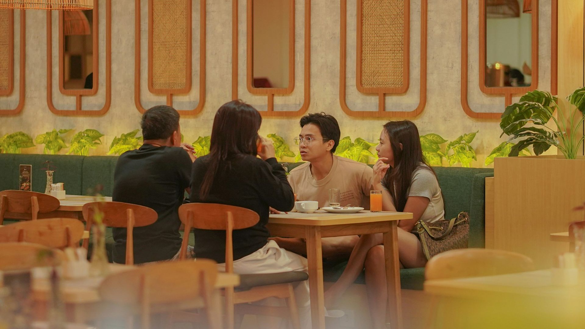 People dining at tables in a modern cafe
