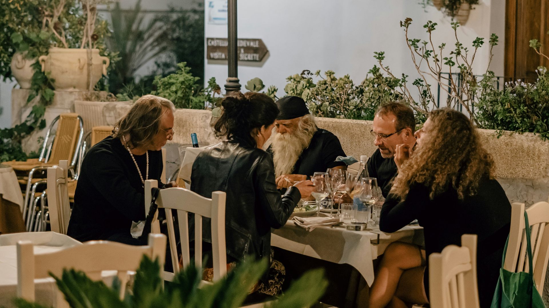 people sitting on chairs inside restaurant