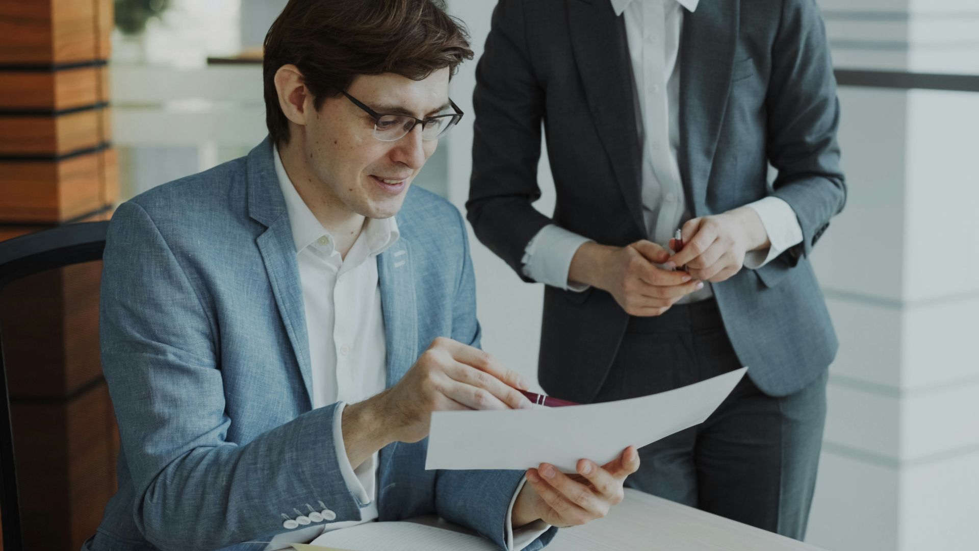 Two business people reviewing documents together