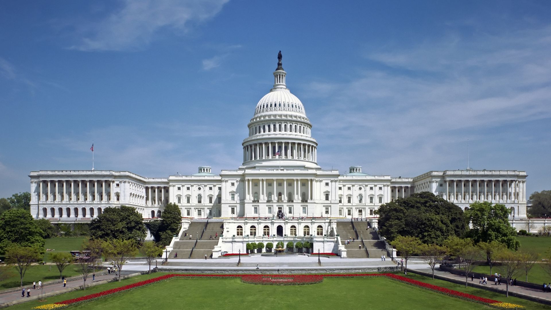 The western front of the United States Capitol. The Neoclassical style building is located in Washington, D.C., on top of Capitol Hill at the east end of the National Mall. The Capitol was designated a National Historic Landmark in 1960.