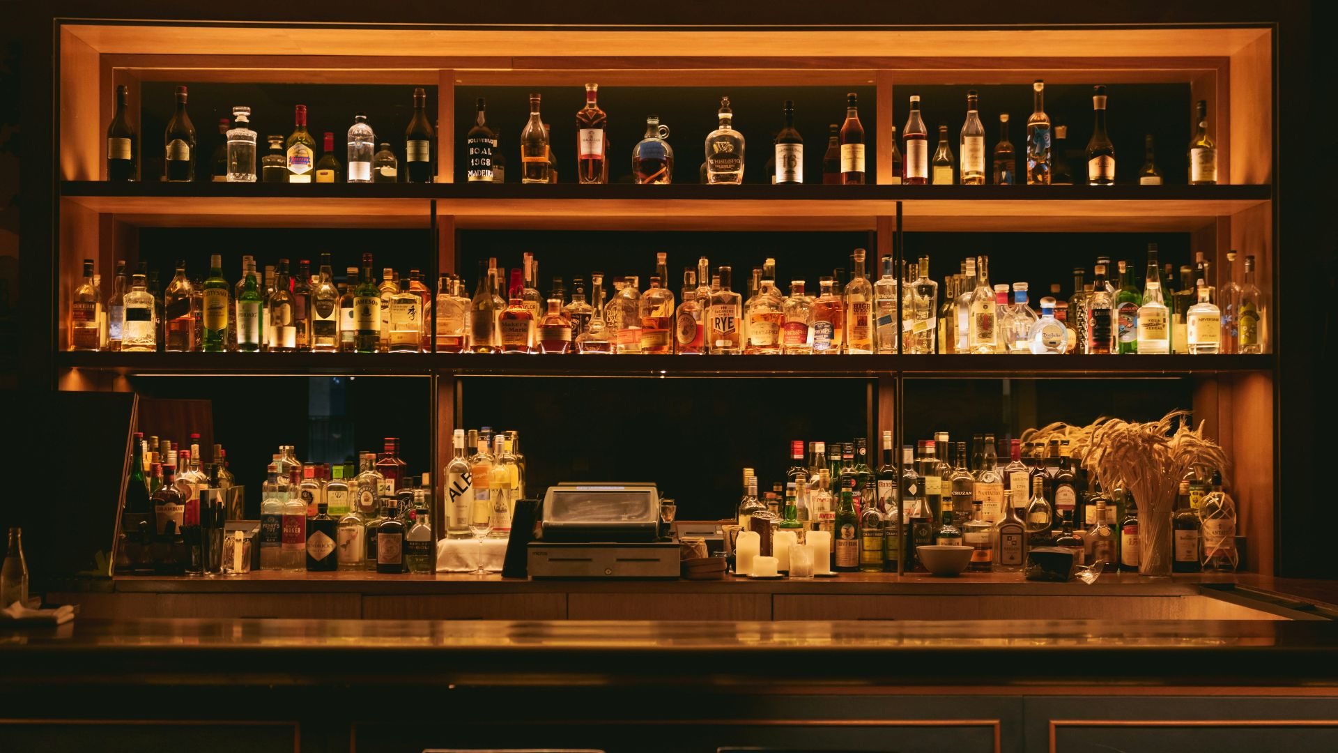 brown wooden shelf with bottles