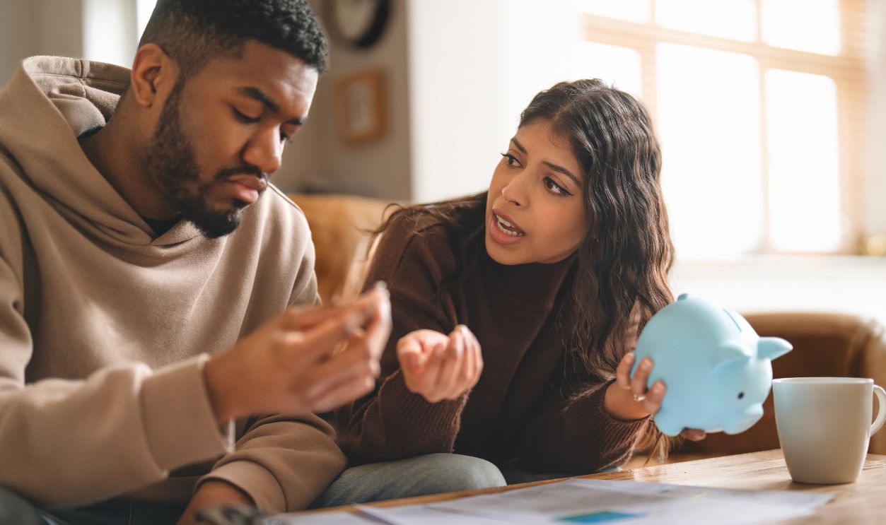 Couple discusses financial planning while sitting at home during the afternoon