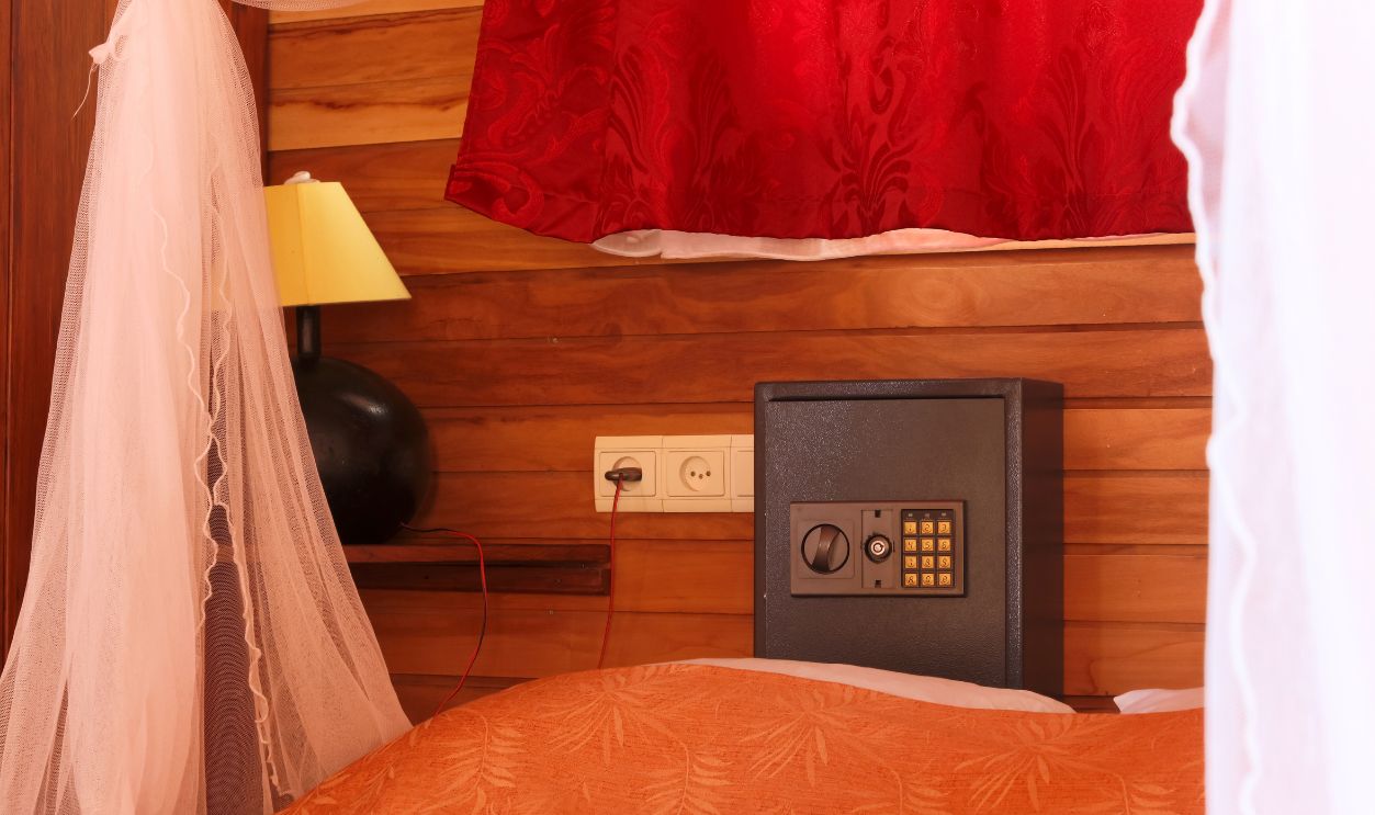 Black safe box in hotel room in open position