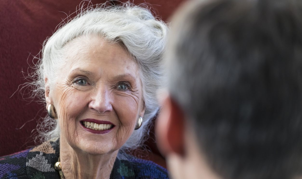 Mature woman talking with young man