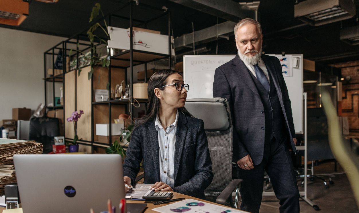 Business professionals engaged in a productive discussion in a modern office setting with documents