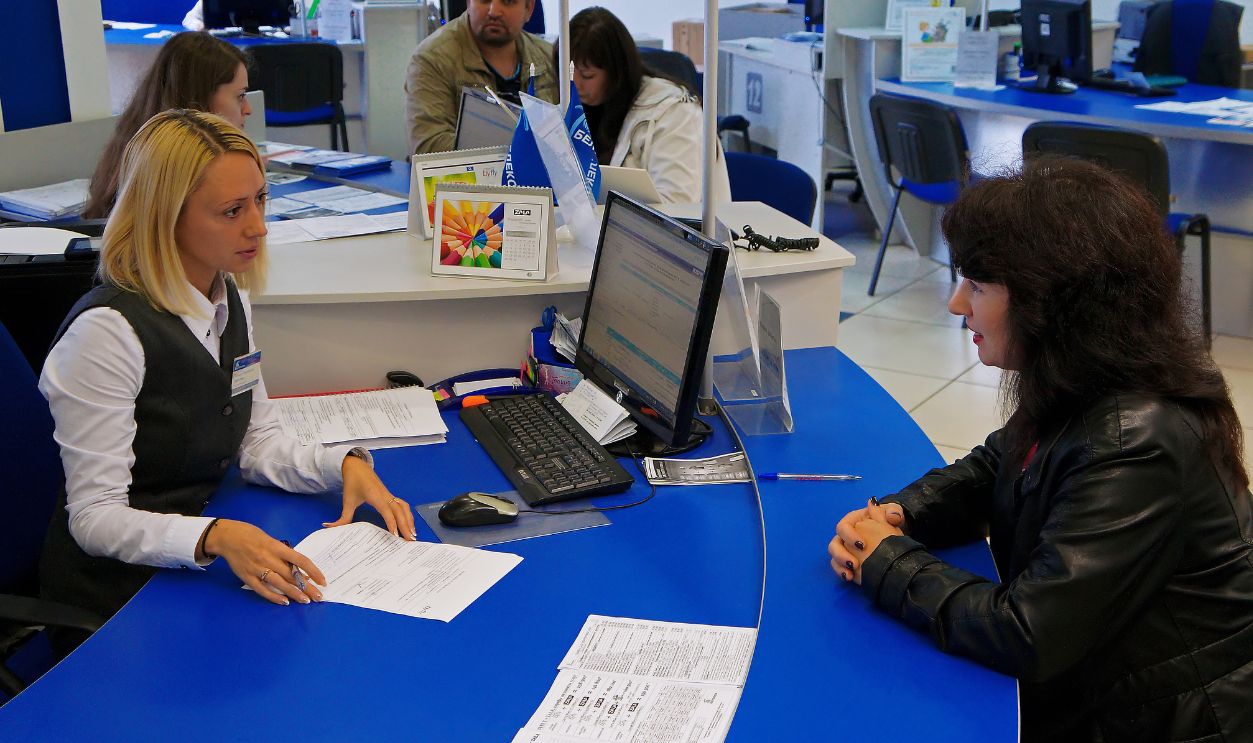 Belarus, Bobruisk, September 24, 2015: Agent tells the client the terms of the contract for the provision of services