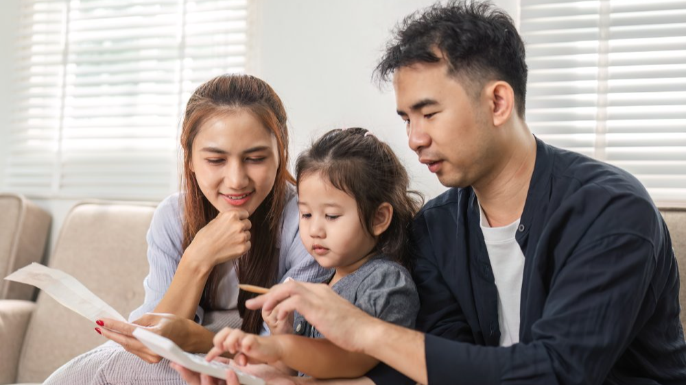 Family budgeting session with a focus on savings and financial education. Budget management and accounting on table. Business finance accounting banking concept.