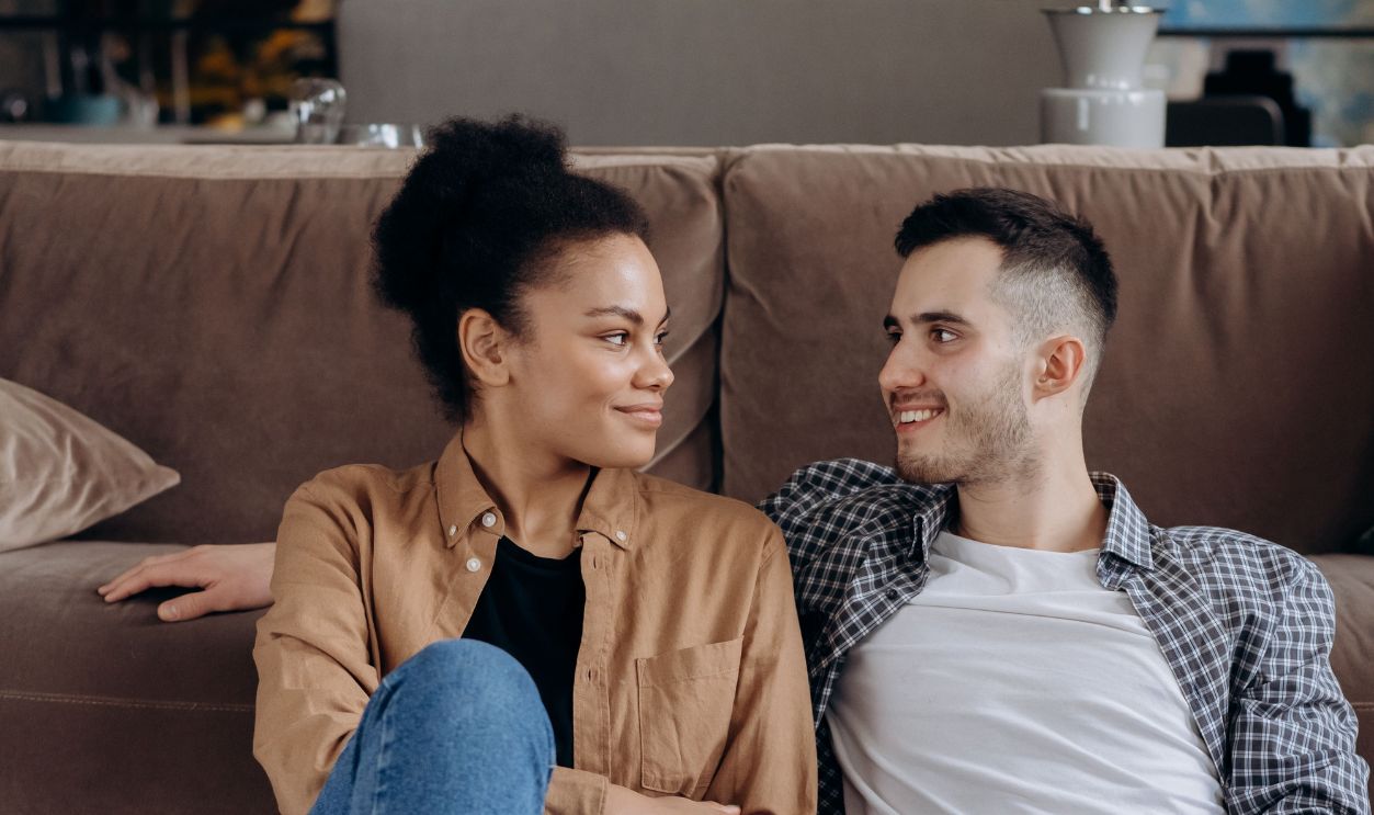 Happy couple enjoying a cozy time together on the floor 