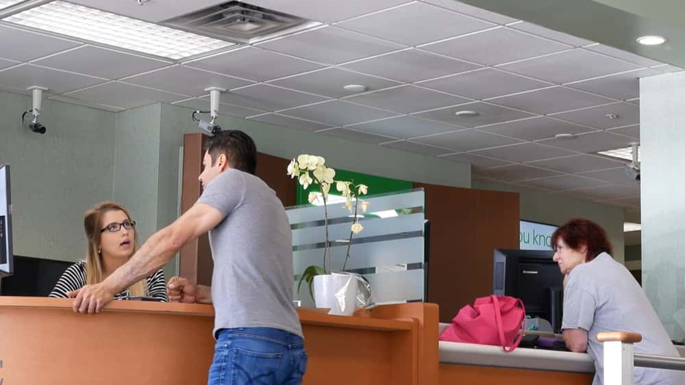 Coquitlam, BC, Canada - May 14, 2018 : Motion of people talking to the teller at service counter inside TD bank