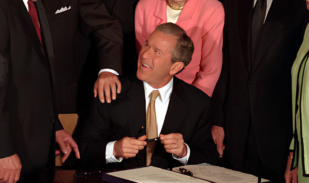 President George W. Bush signs the tax bill on Thursday, June 7 in the White House.