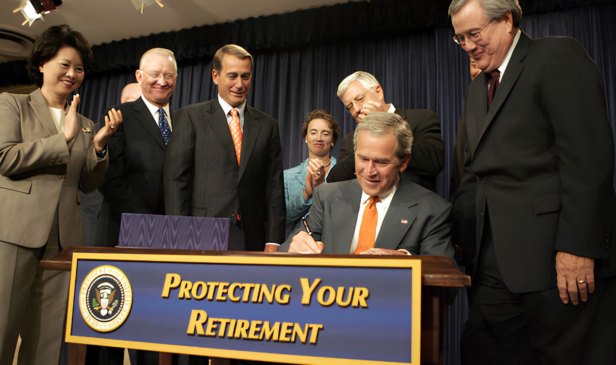 President George W. Bush signs into law H.R. 4, the Pension Protection Act of 2006, Thursday, Aug. 17, 2006. Joining him onstage in the Eisenhower Executive Office Building are, from left: Secretary of Labor Elaine Chao; Rep. Buck McKeon of California; Rep. John Boehner of Ohio; Senator Blanche Lincoln, D-Ark.; Senator Michael Enzi, R-Wyo., and Rep. Bill Thomas of California.
