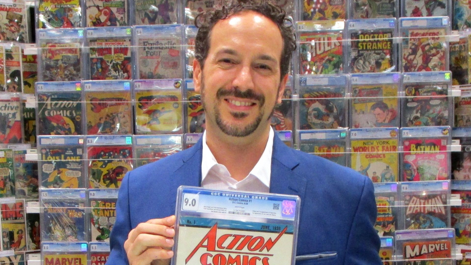 At the 2014 New York Comic Con, Vincent Zurzolo of Metropolis Collectibles displays the CGC 9.0 copy of Action Comics #1 that his firm paid $3.2 million (USD) for.