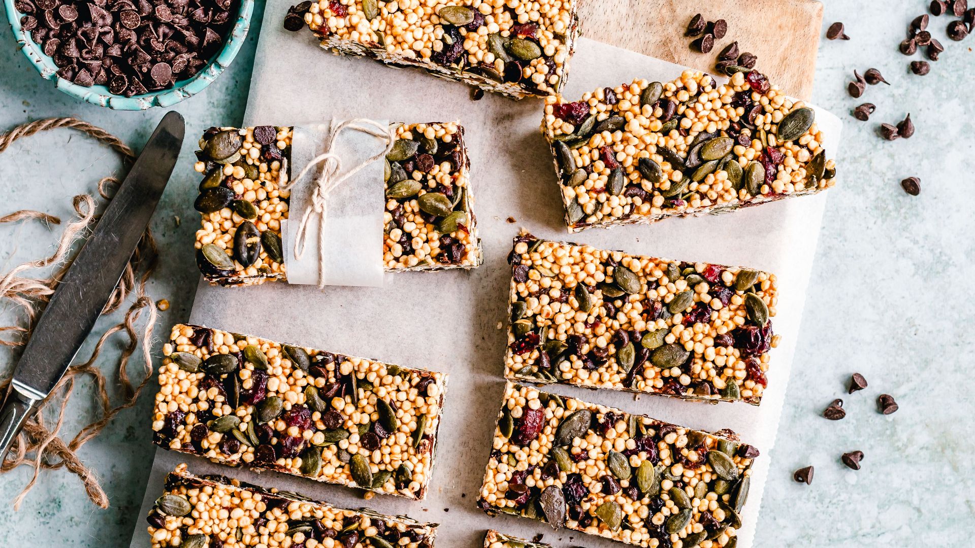 Top view of homemade granola bars with seeds and chocolate chips.
