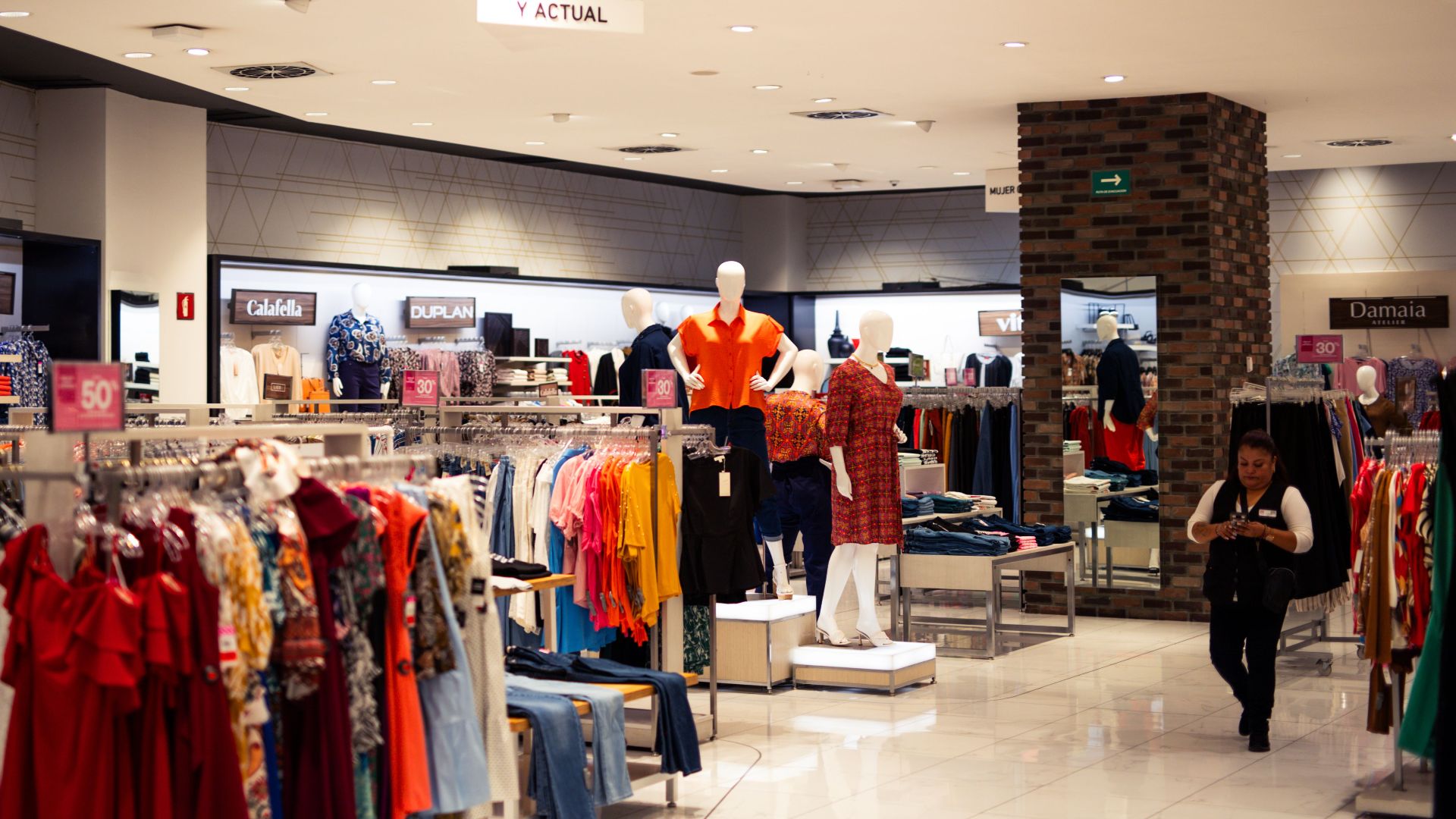 Bustling fashion boutique showcasing contemporary clothing and accessories.