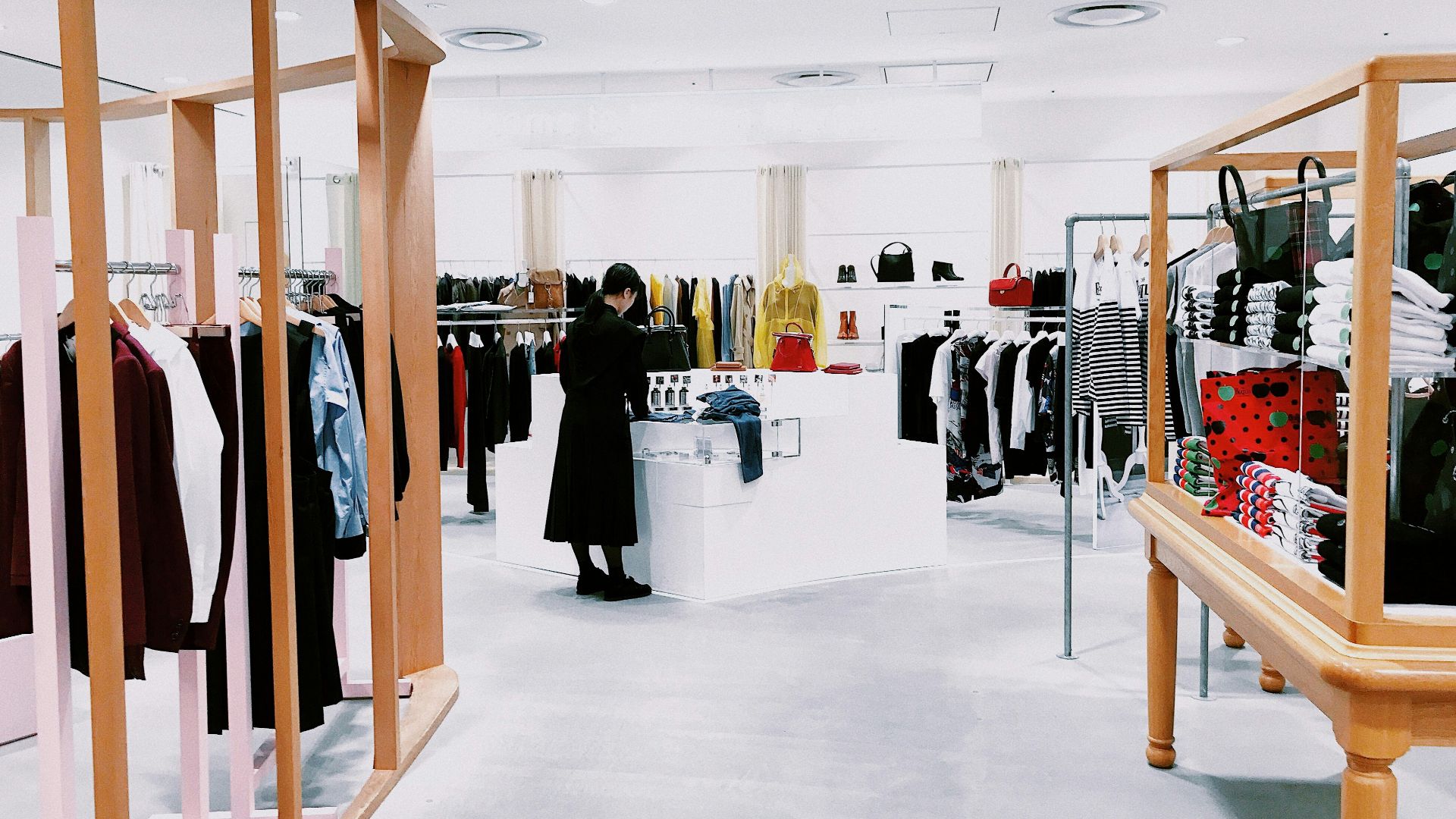 woman standing inside clothing area