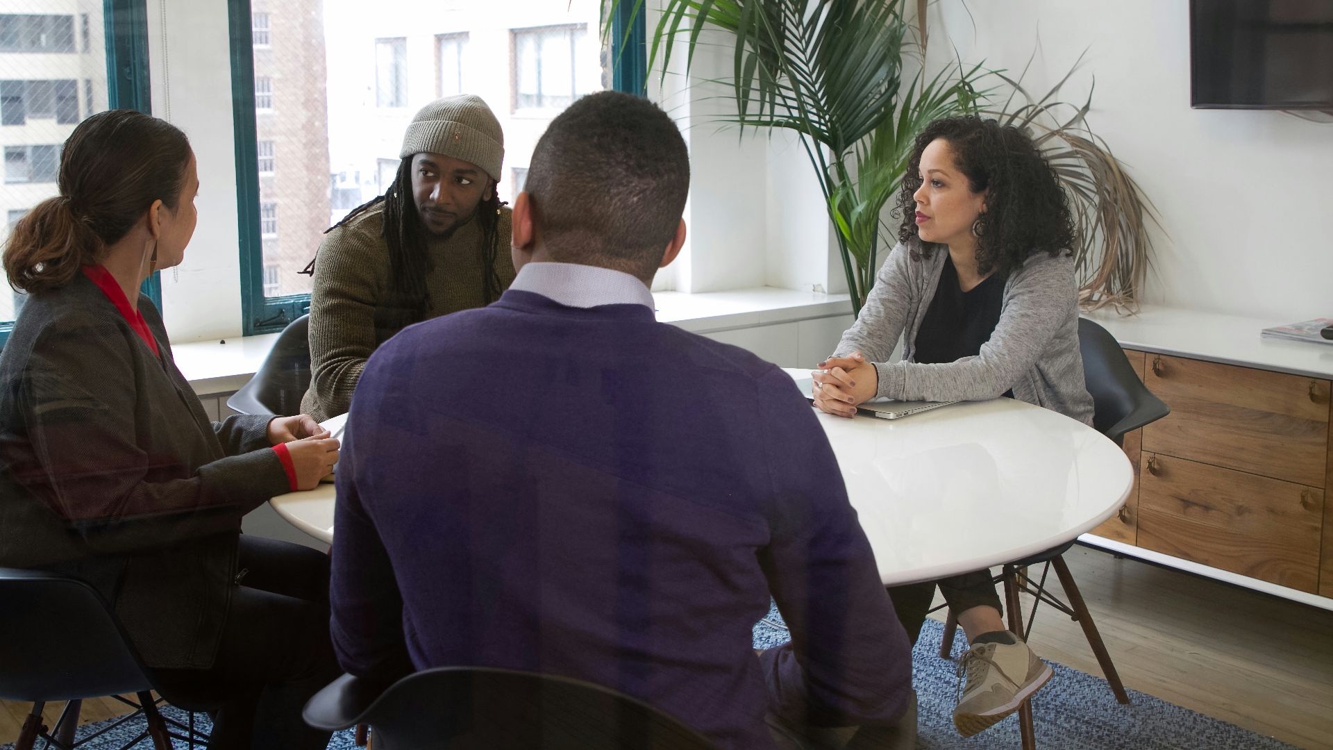a group of people sitting around a table
