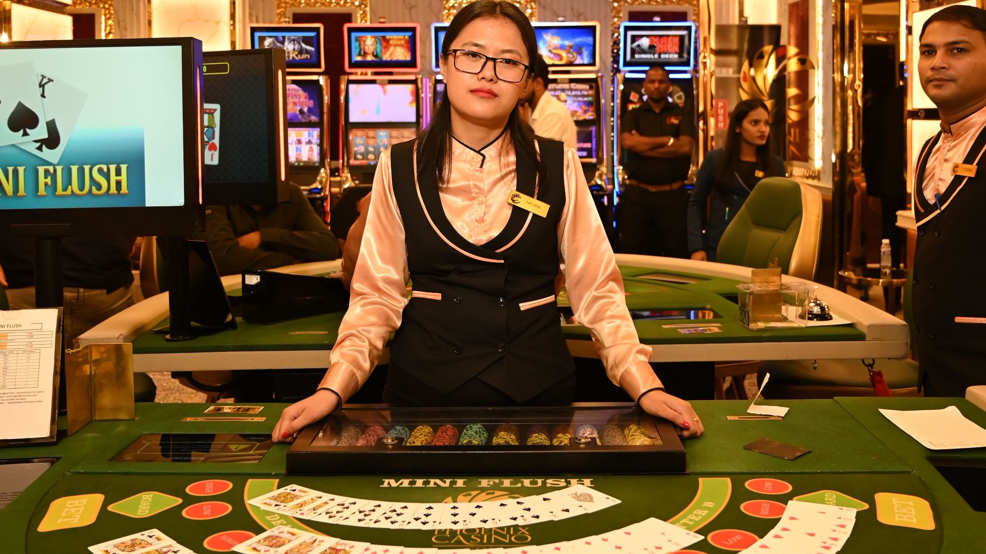 Luxurious casino gaming table in Goa, India, featuring attentive staff and vibrant ambiance.