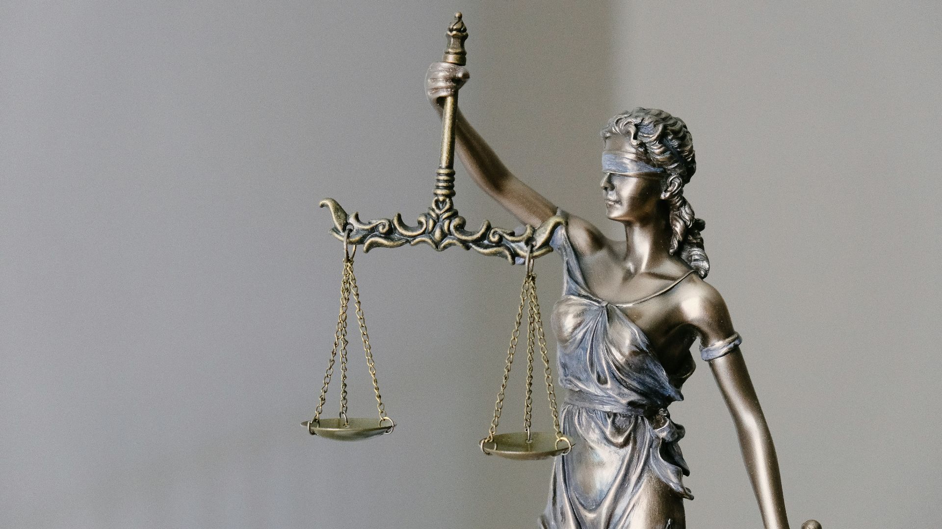 lady justice statue with scales and sword