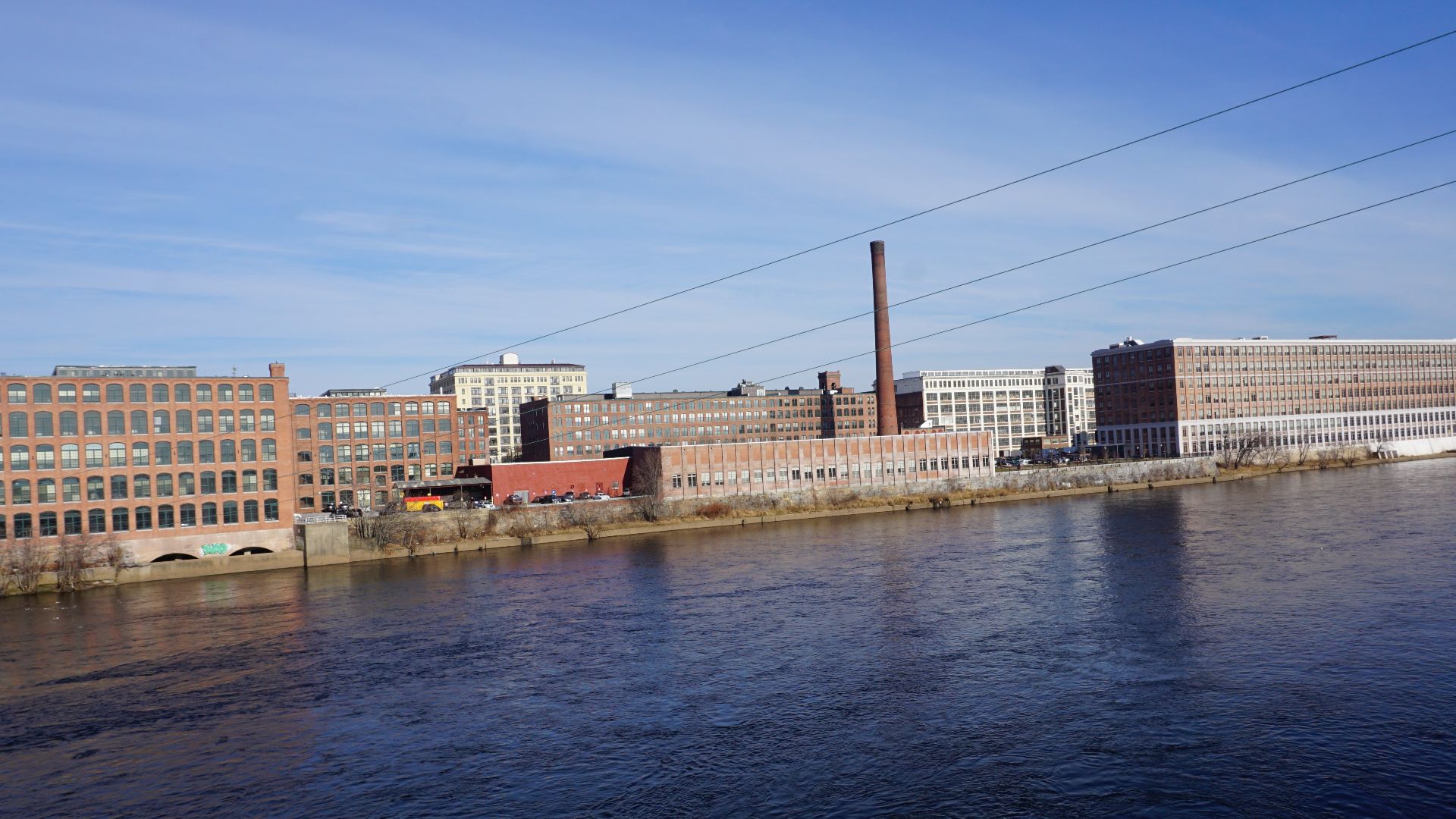 Panoramic photo of Lawrence Massachusetts (USA) skyline on Dec 21, 2021 taken from the Joseph W. Casey Bridge (Amesbury Street) overlooking the Merrimack River, facing Northeast.