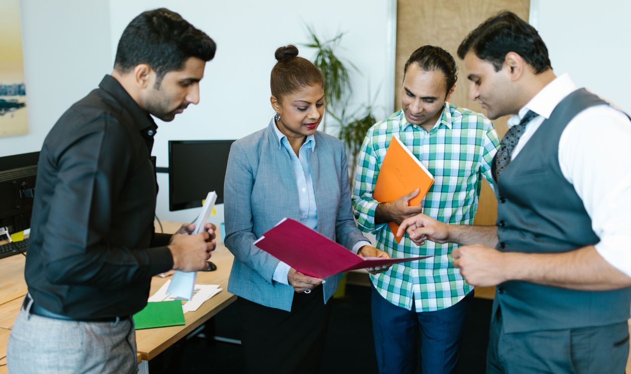 Business team engaged in discussion during a meeting in a modern office setting