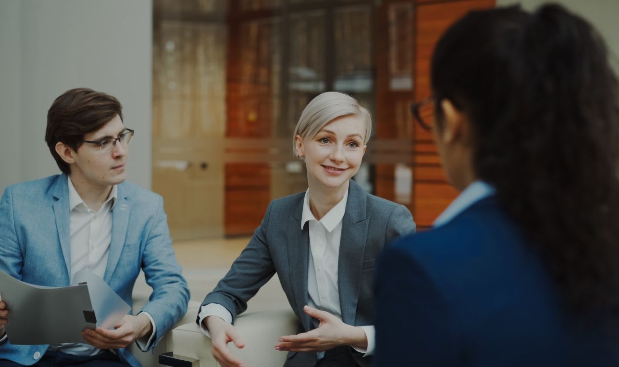 Group of professionals having a discussion in a modern office setting