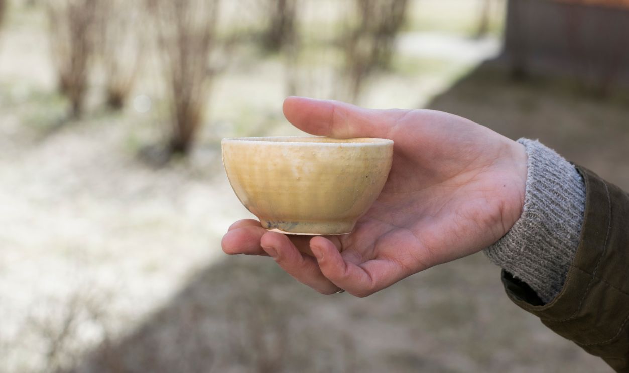 Ceramic bowl, cup, teabowl in a hand
