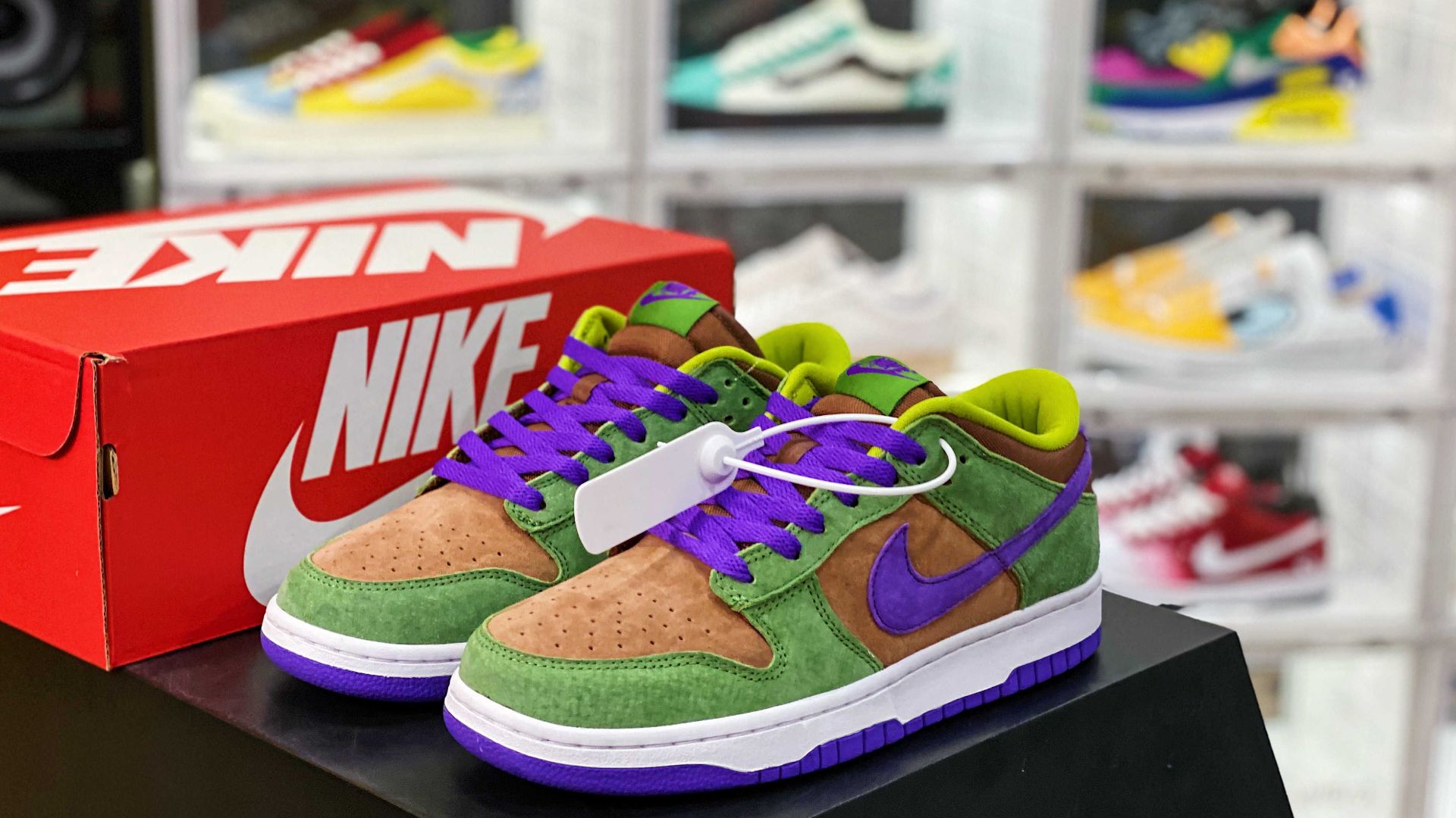 Colorful sneakers with Nike logo displayed in a stylish shoe store with a blurred background.