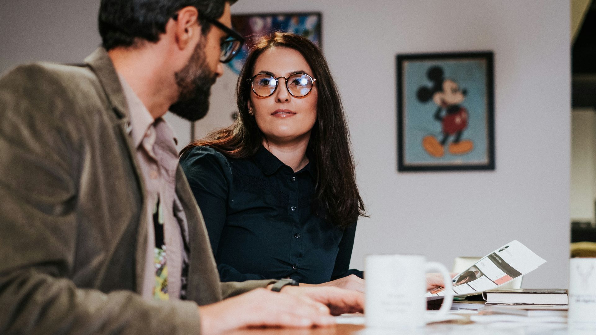 man and woman sitting at table