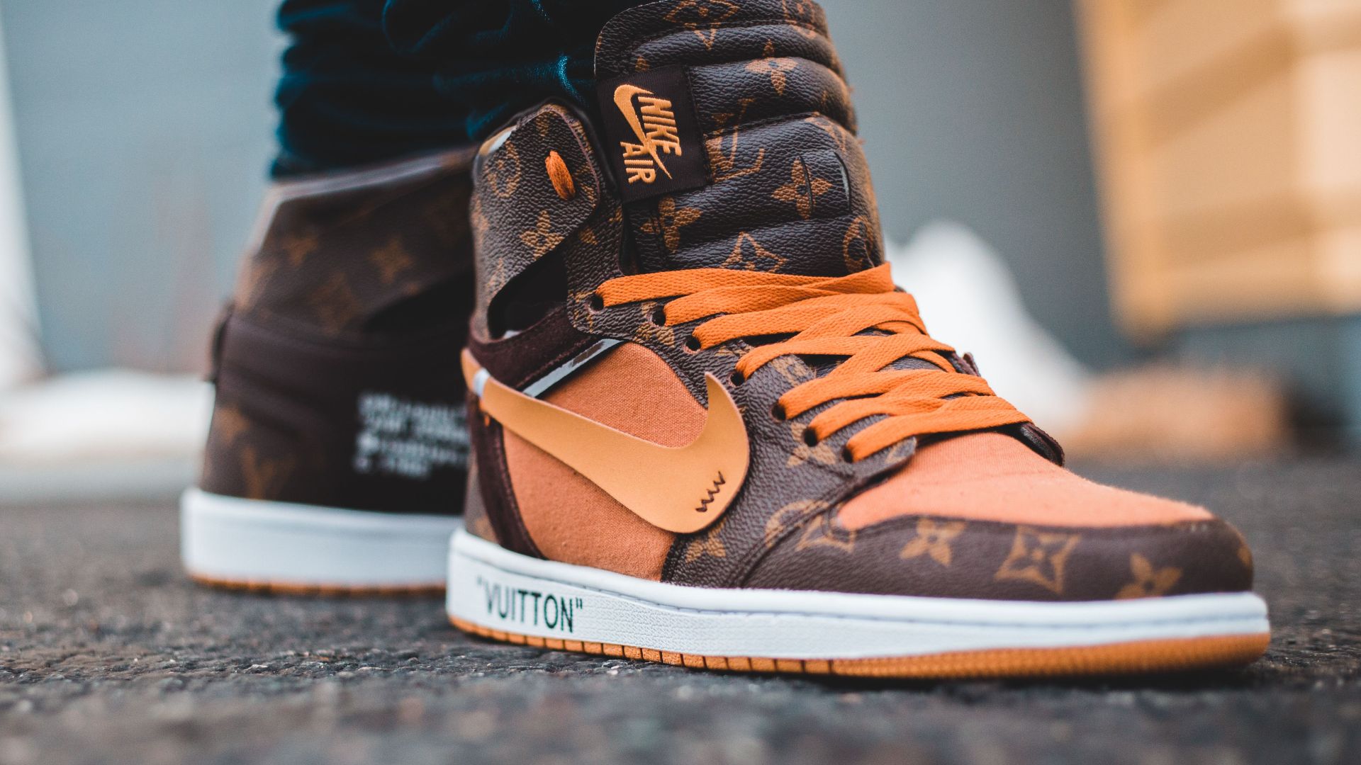 Close-up of luxury Nike Air sneakers with Louis Vuitton design, showcasing style and fashion detail.