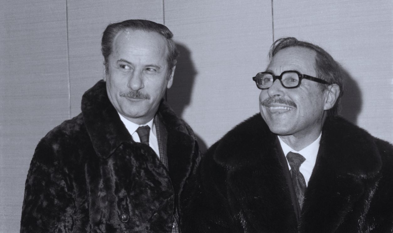 Gettyimages - 515291522, Tennessee Williams with Eli Wallach (Original Caption) All decked out in a fur coat, playwright Tennessee Williams arrives at the Vivian Beaumont theater on opening night of the revival of his play, Camino Real. He is seen here with Eli Wallach.