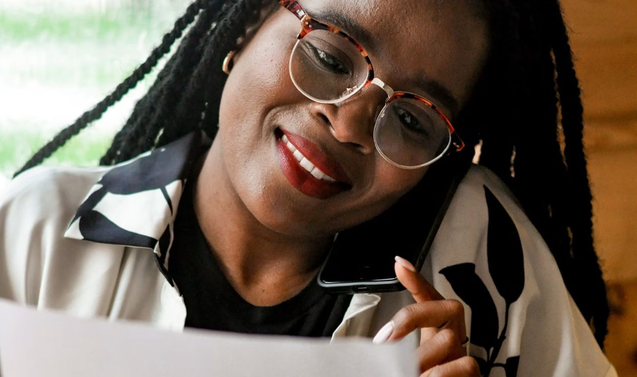 a person holding a paper