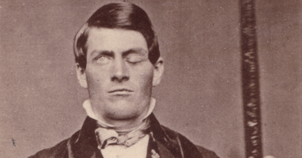 Cabinet-card portrait of brain-injury survivor Phineas P. Gage (1823–1860), shown holding the tamping iron which injured him;