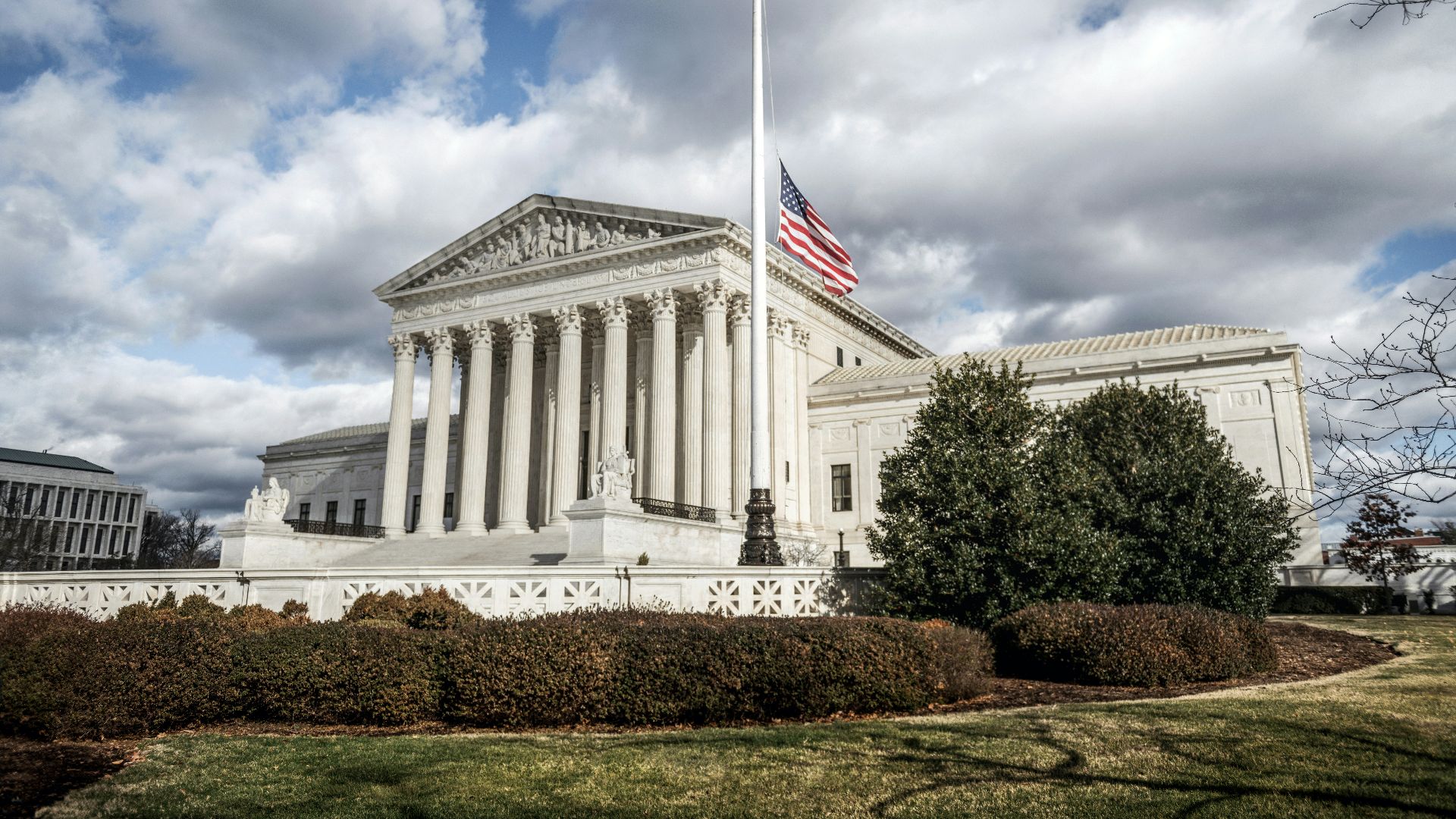 a large building with a flag on top of it