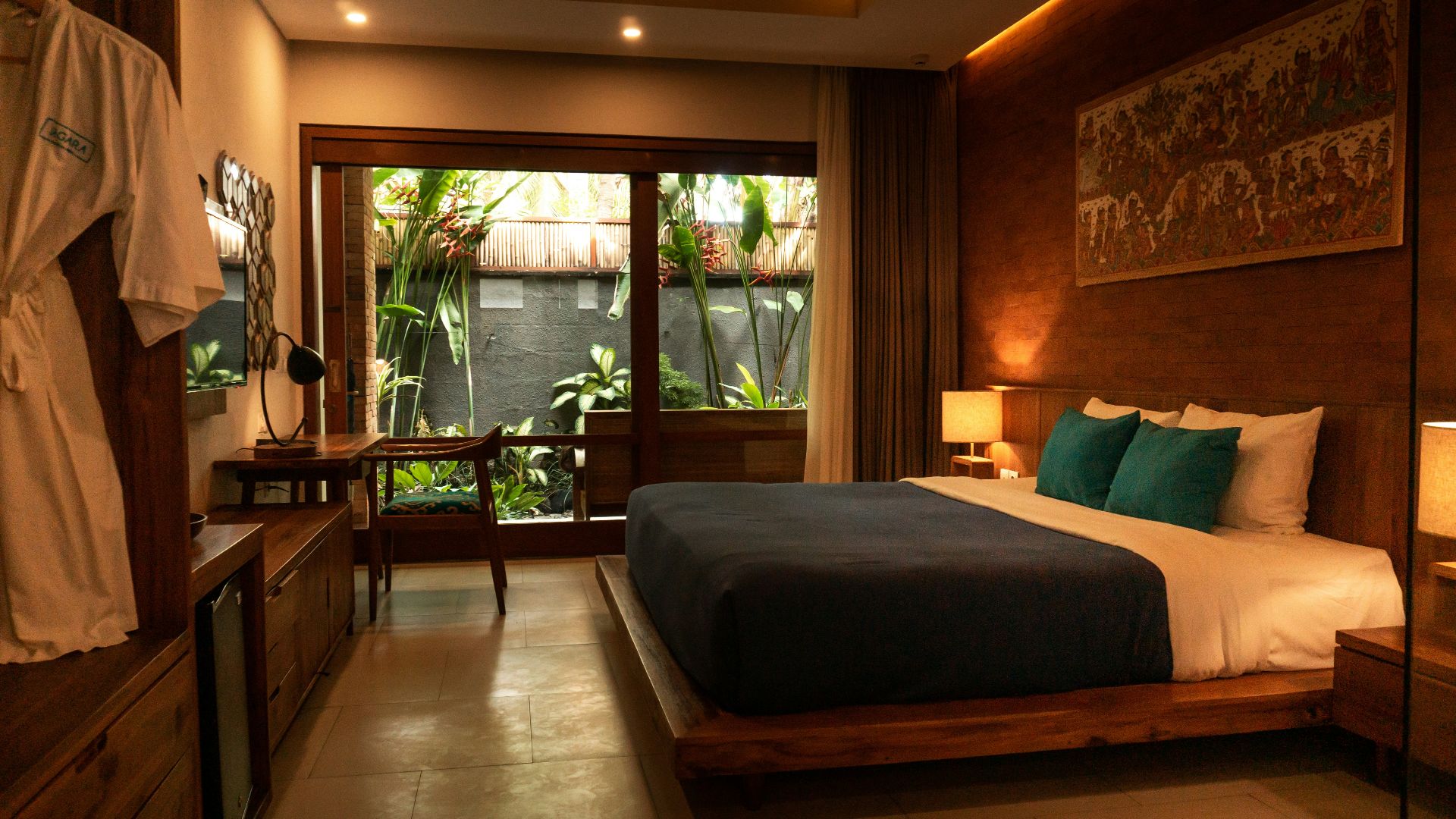 black and white bed near brown wooden table