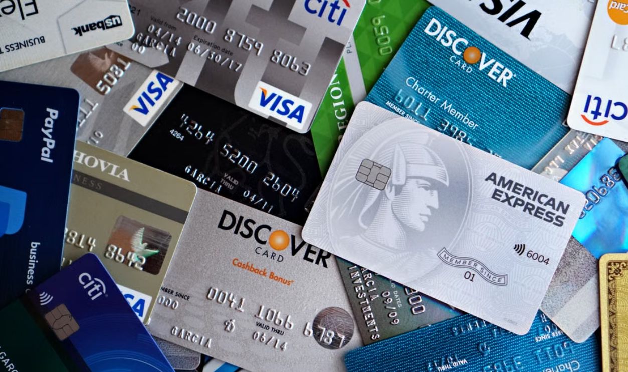 A flat lay of assorted credit and debit cards from various banks. Ideal for finance and banking concepts