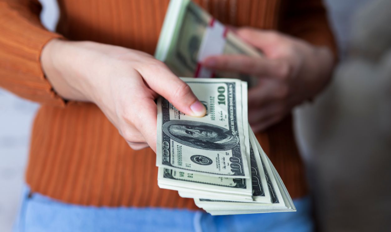 Businesswoman hands holding a money.