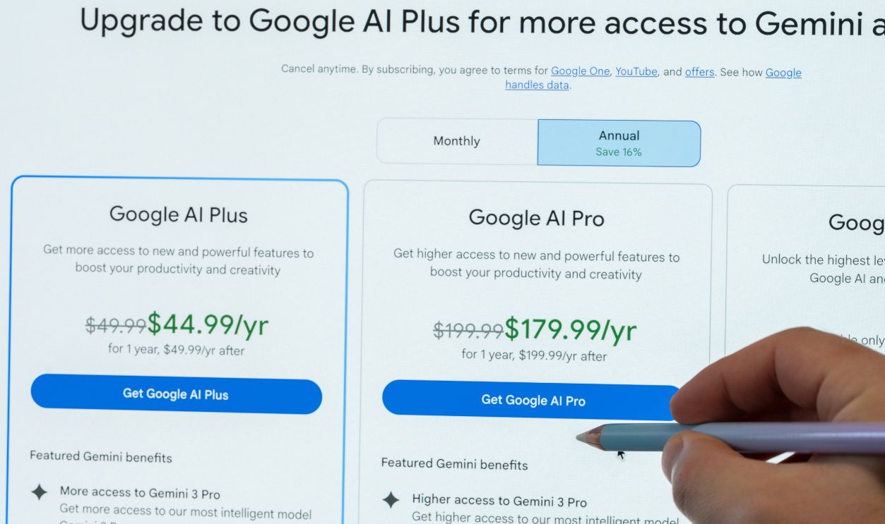New York, USA - May 12, 2026: Choosing subscription plan of google AI plus platform pointing with pencil on pc screen close up view