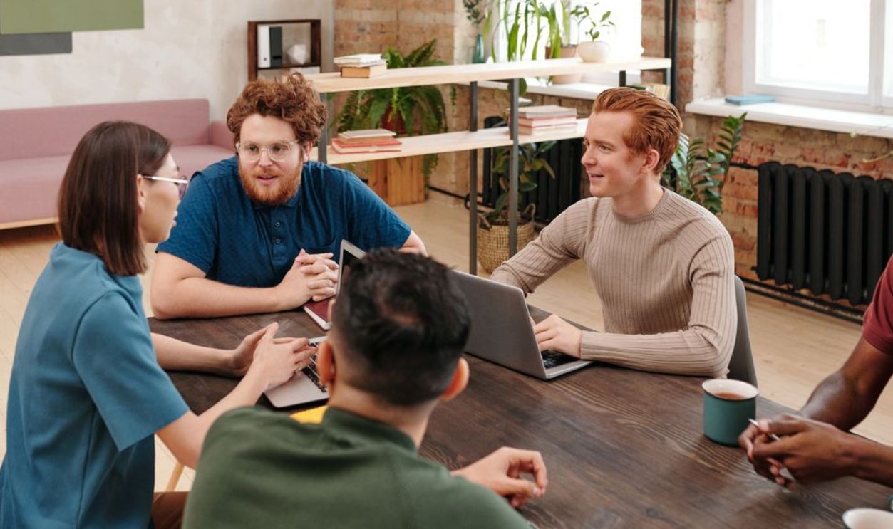 Professional team engaged in a collaborative work meeting in a modern office setting