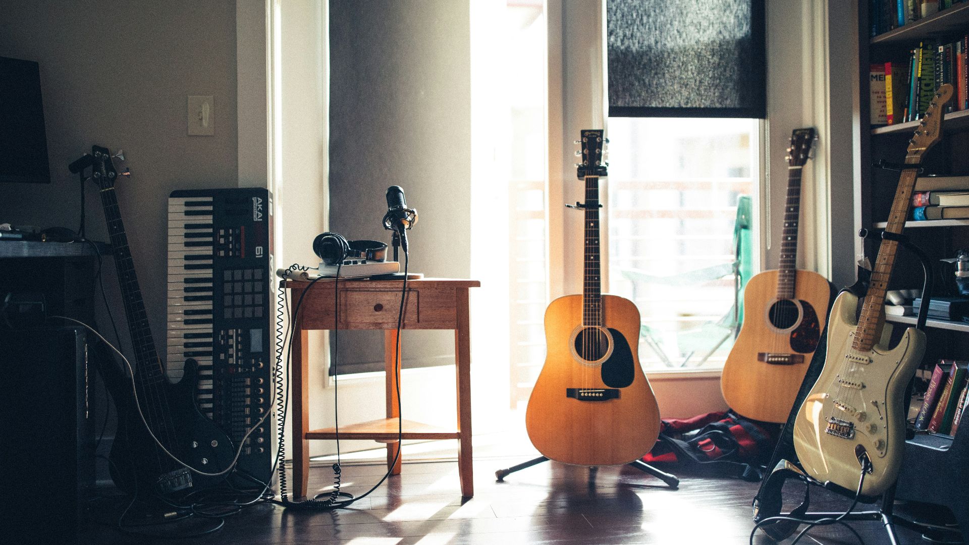 several guitars beside of side table
