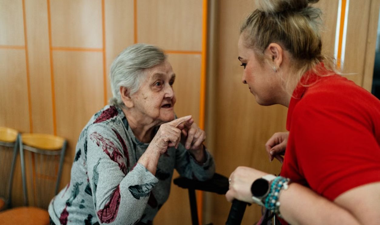 Woman talking to elder daughter