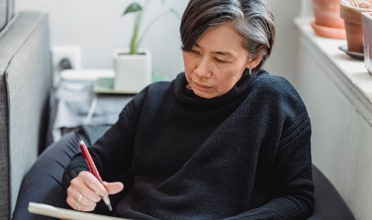 Old woman writing
