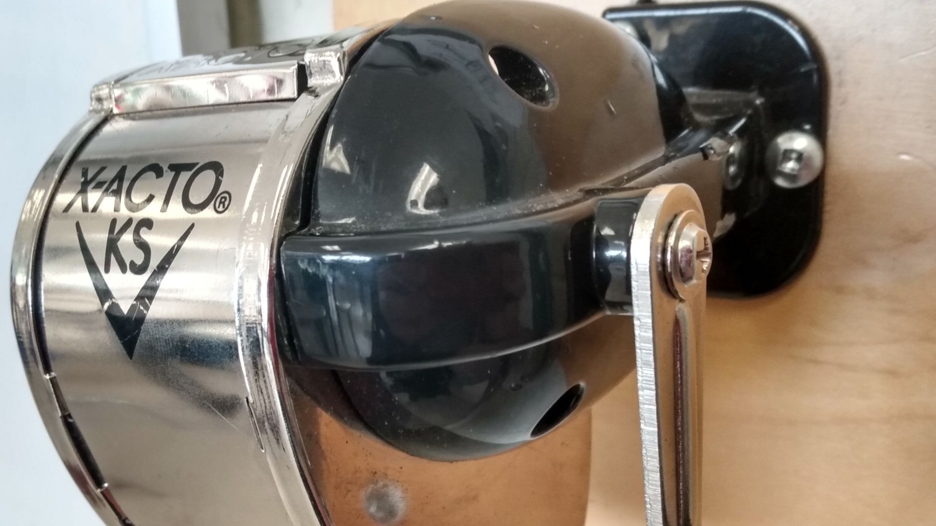 Pencil sharpener attached to a wall.