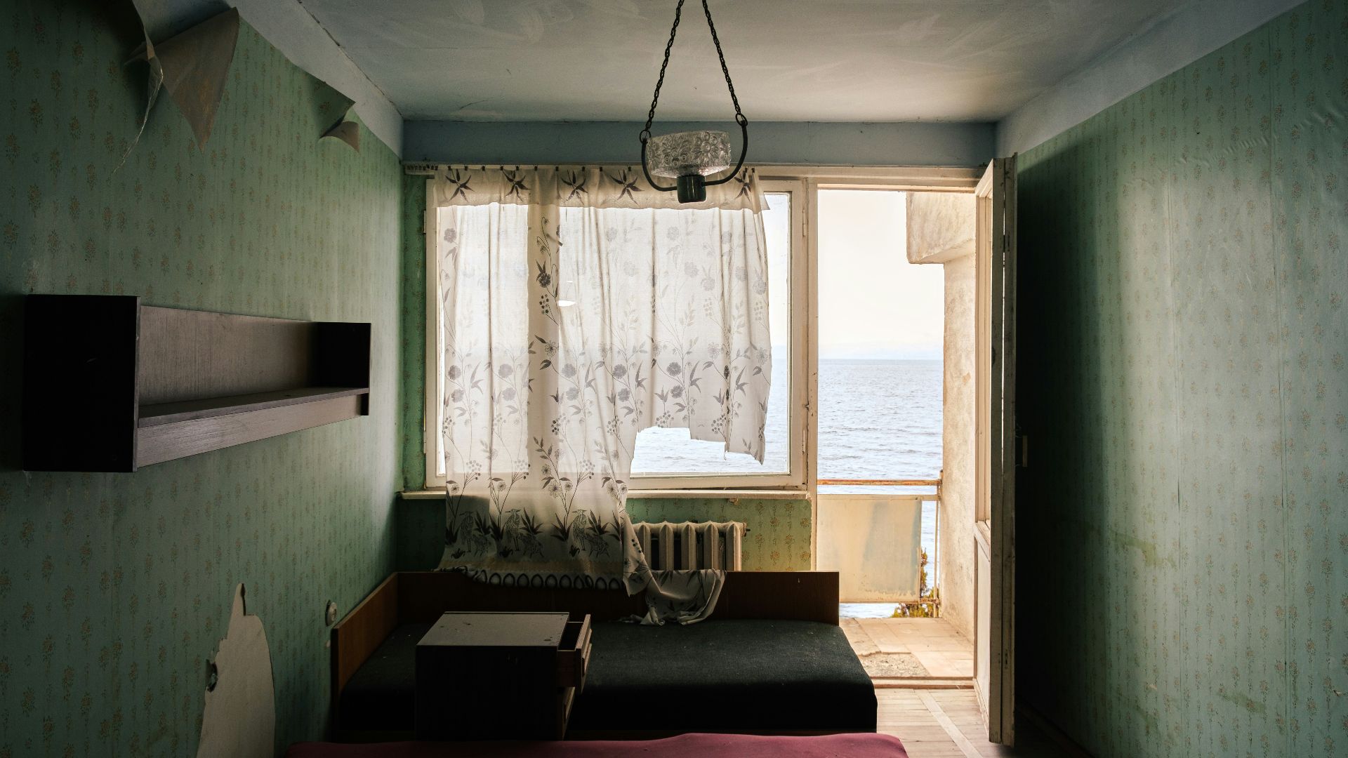 a room with a bed and a window