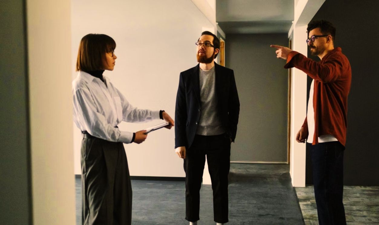 Colleagues in an office having a focused discussion about project plans