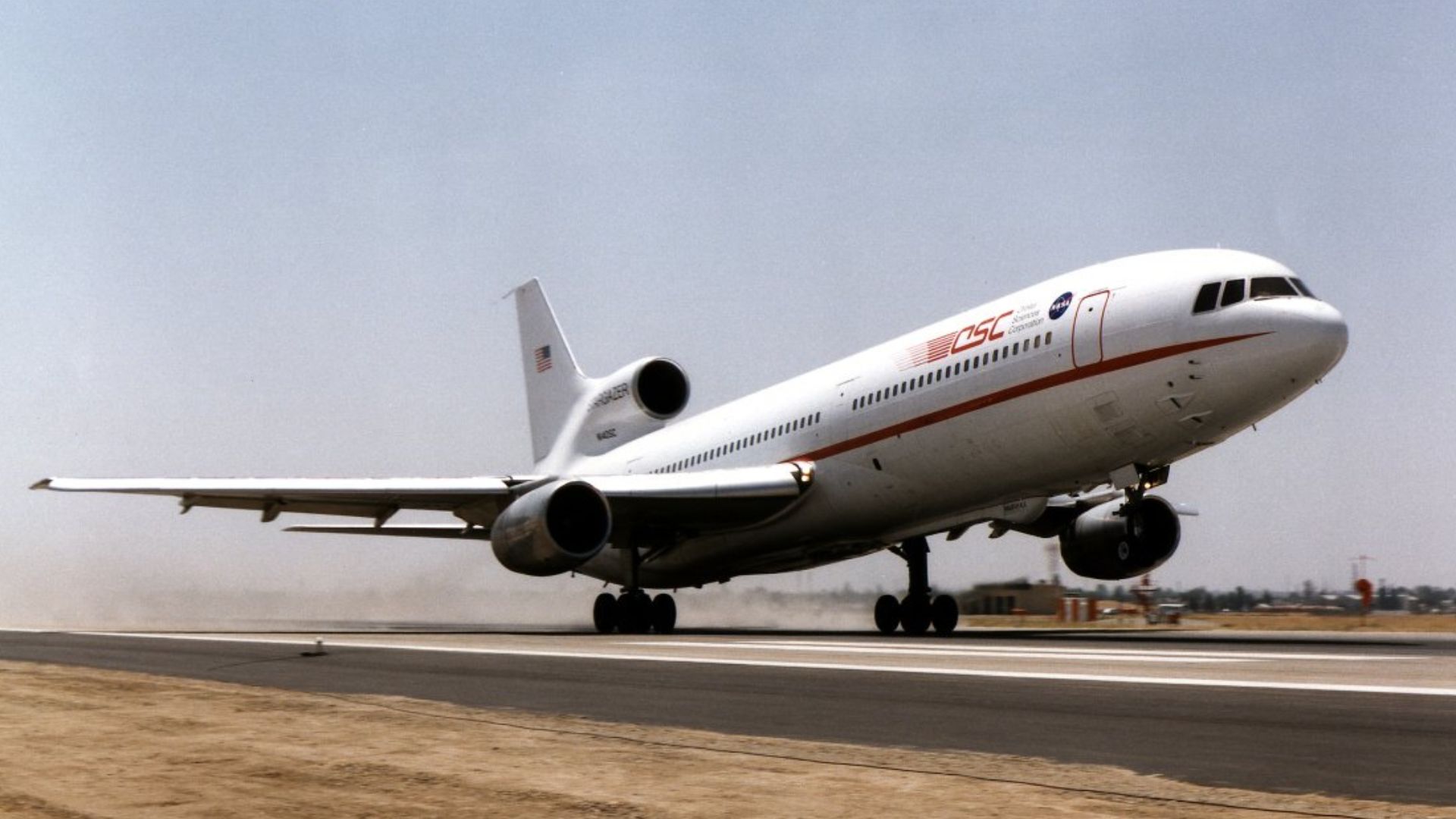 Bearing the logos of the National Aeronautics and Space Administration and Orbital Sciences Corporation, Orbital's L-1011 TriStar lifts off the Meadows Field Runway at Bakersfield, California, on its first flight May 21, 1997, in NASA's Adaptive Performan