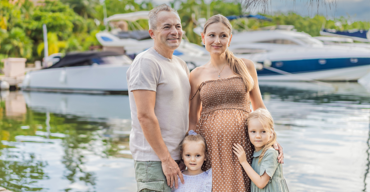 A happy, mature couple over 40 with their two daughters enjoying a leisurely walk on the waterfront