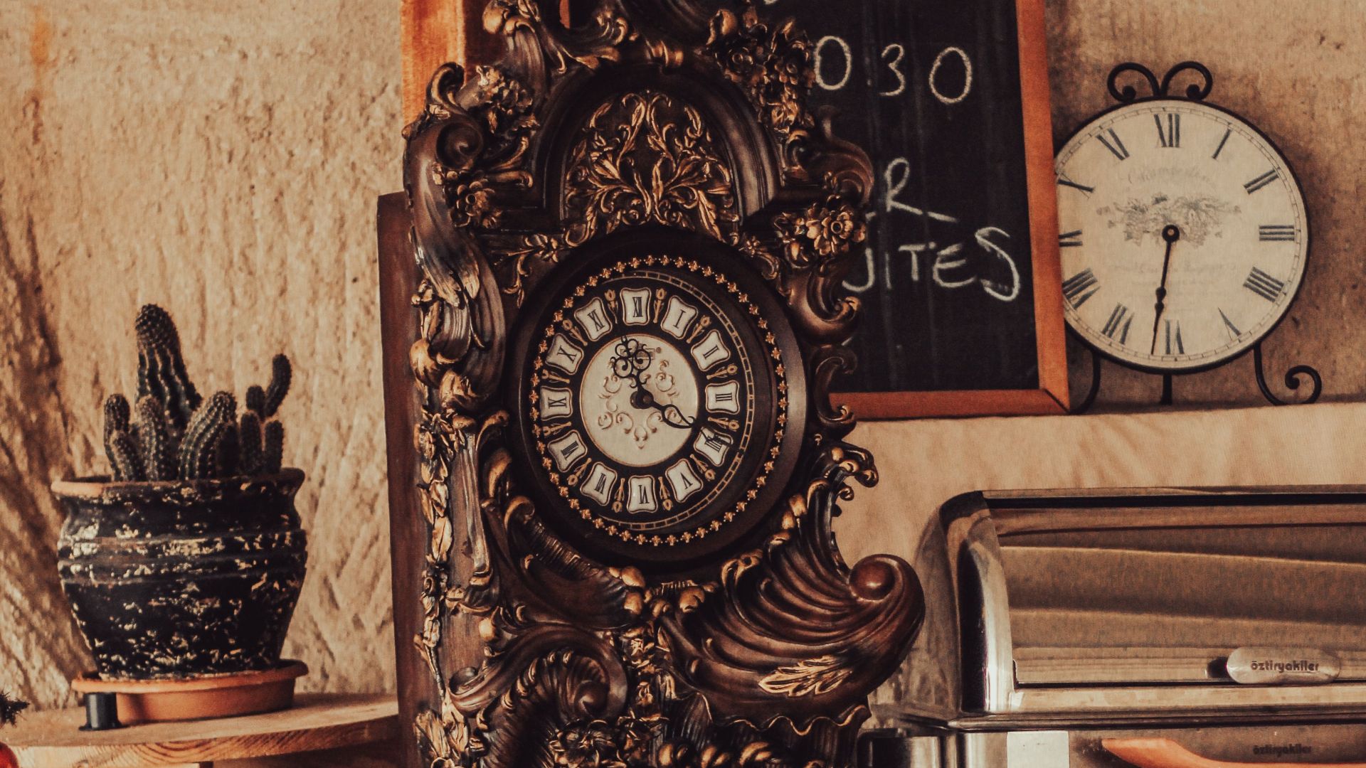 Elegant vintage grandfather clock with intricate details in a cozy, rustic room setting.